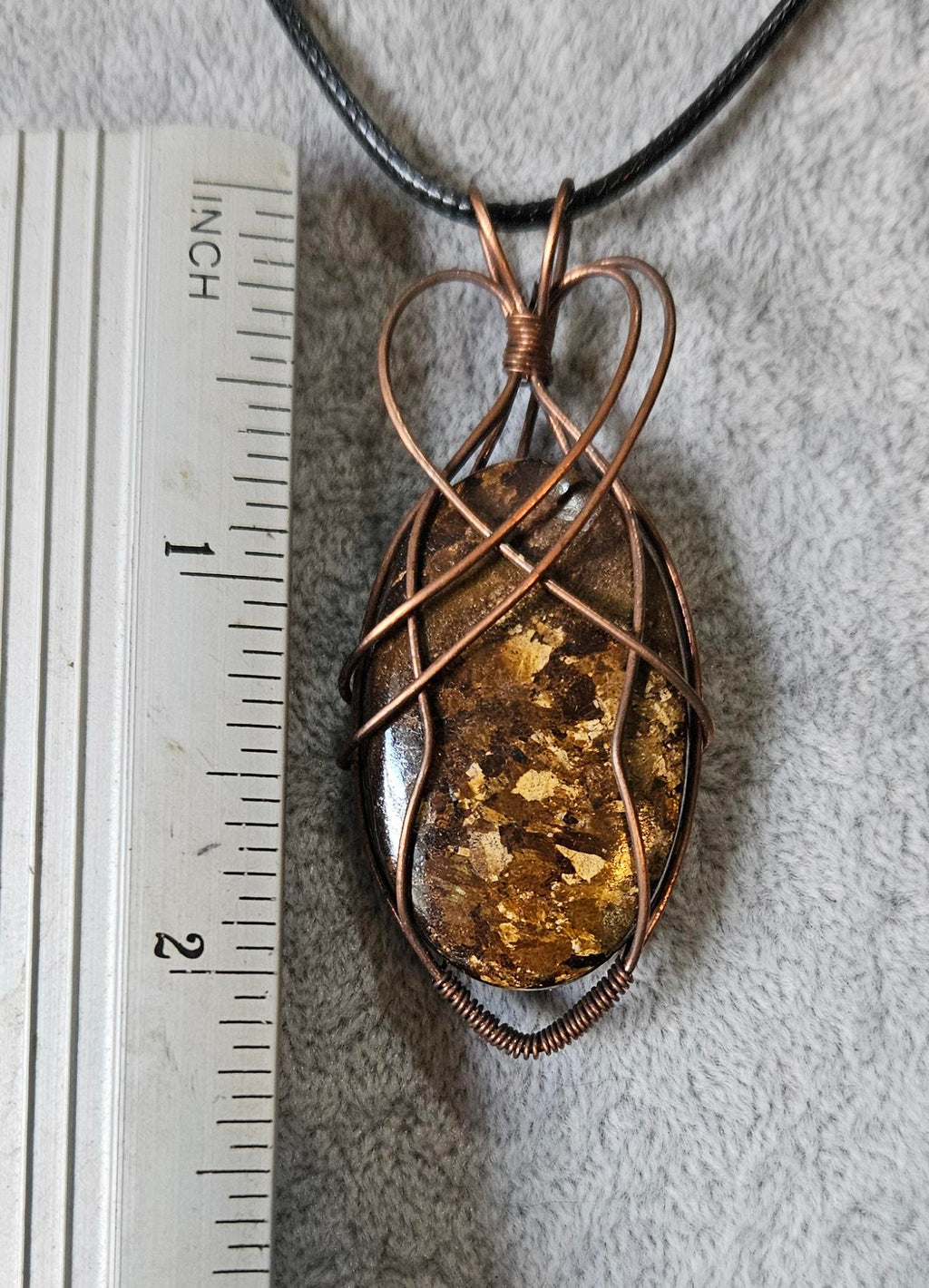 Unique Flashy Bronzite Wire Wrapped Pendant